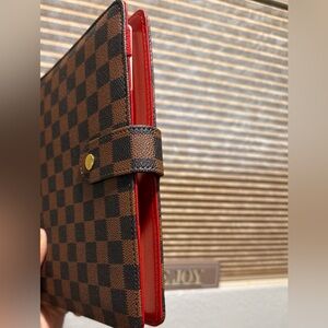 Checkered Brown and Black A5 Planner Cover with Red Interior and Snap Closure.